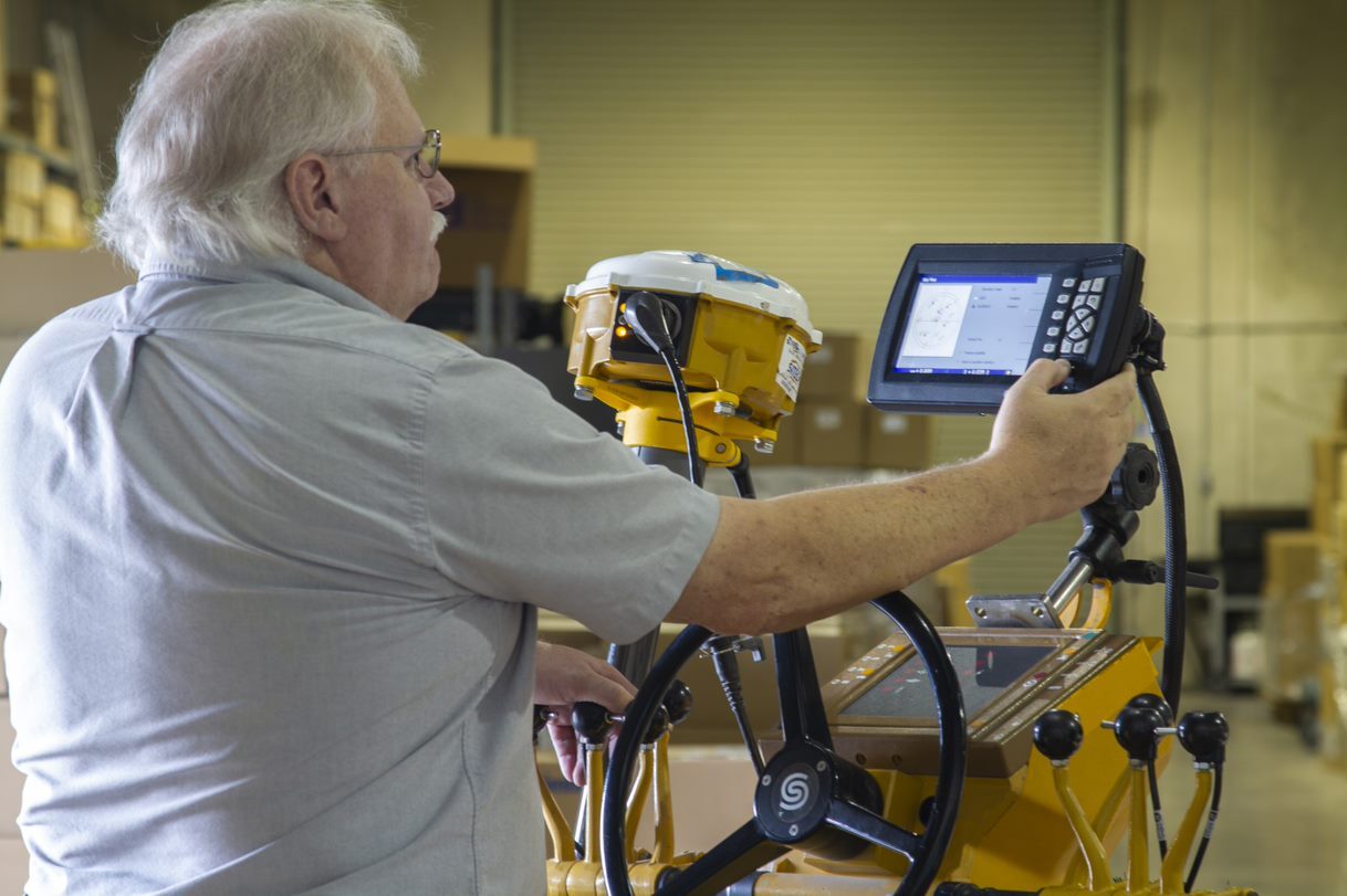 man calibrating machine control system