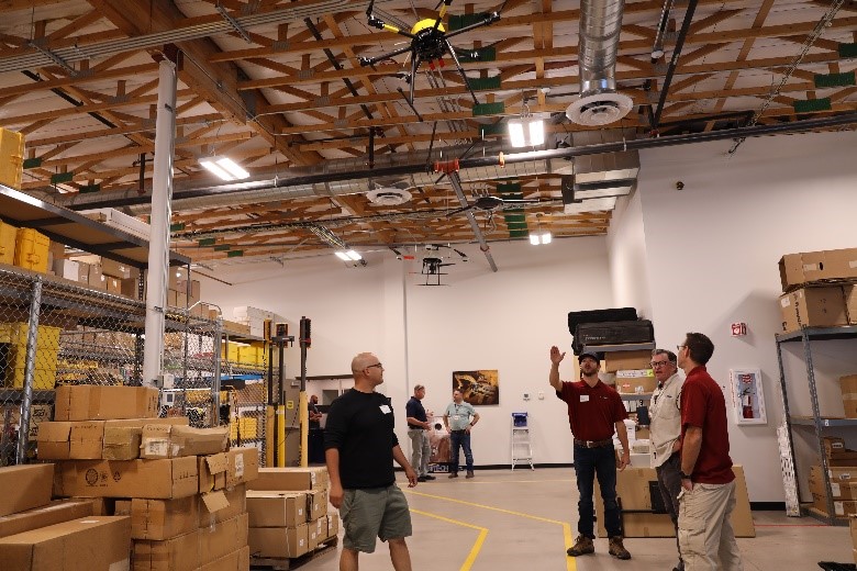 Sitech team in warehouse with drones