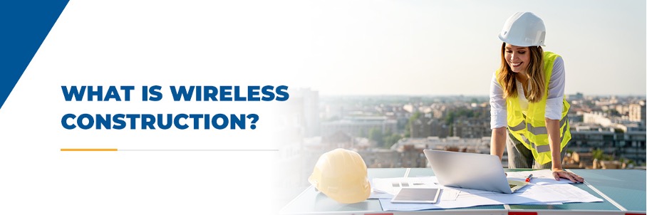 construction worker with hard hat looking at blue prints