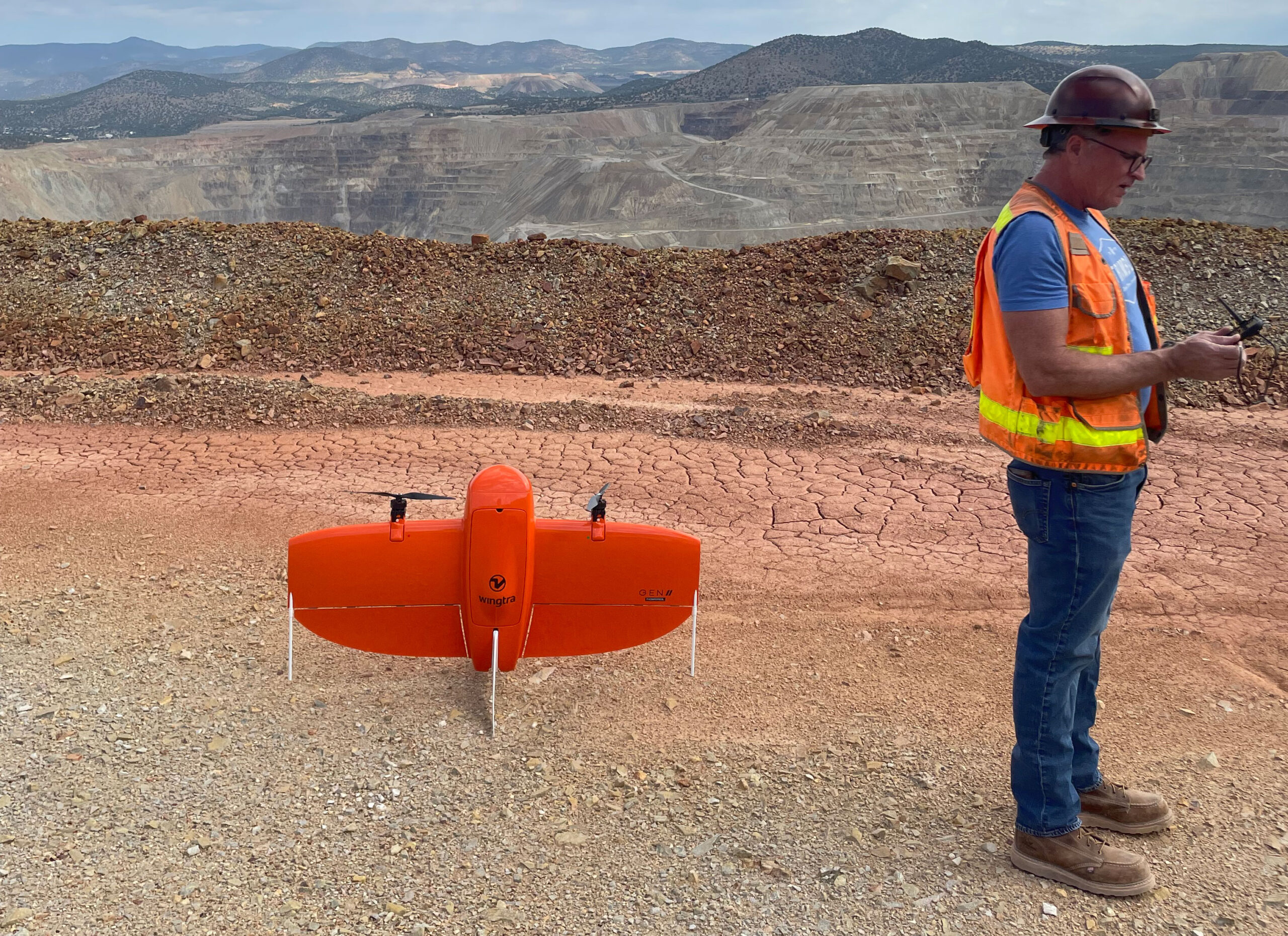 Man on mining site with Wintra drone.